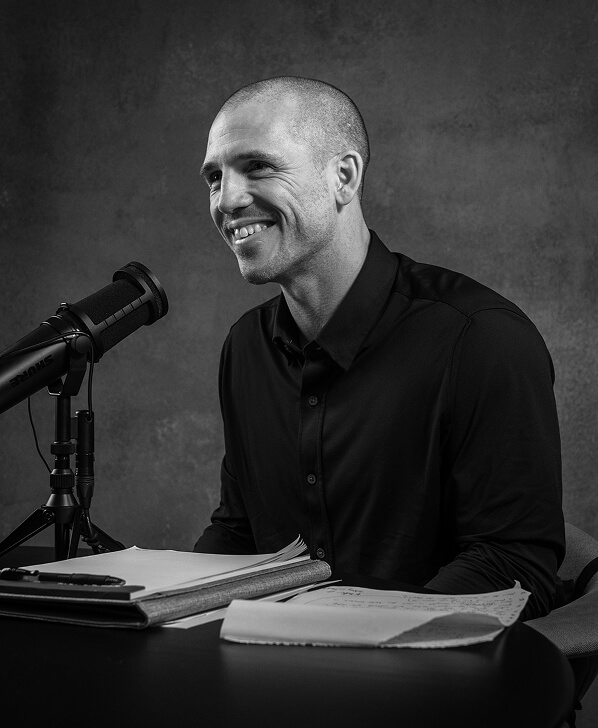 Dr. Andy Galpin speaking into a microphone